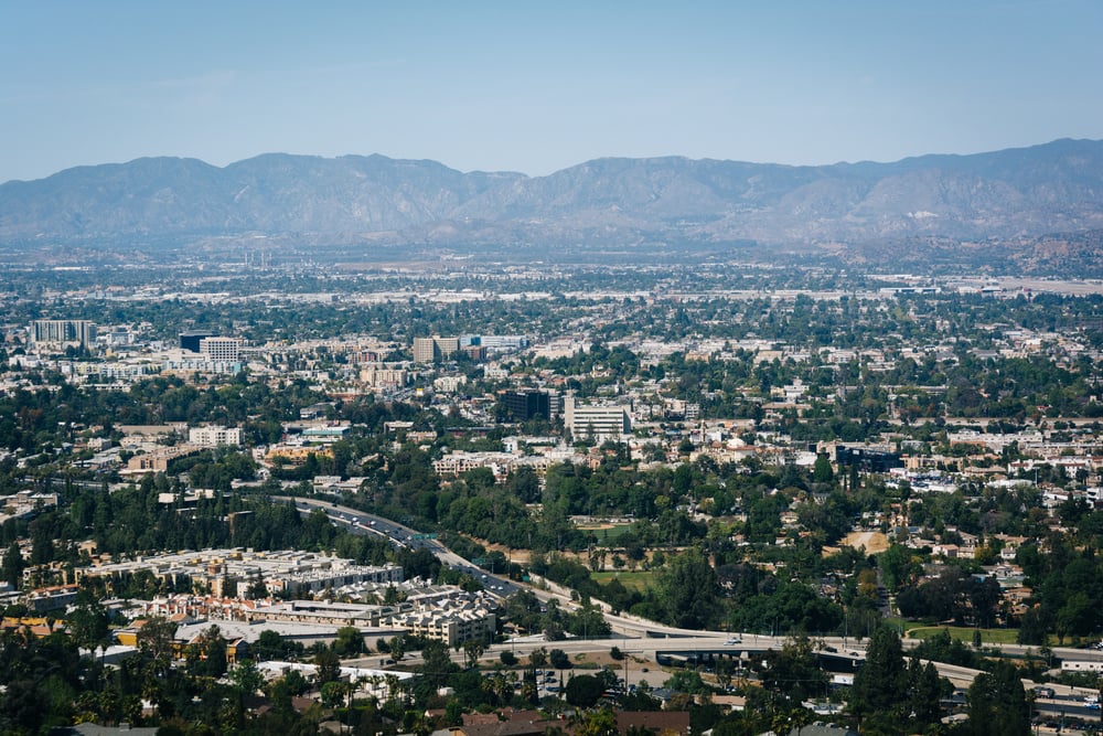 View of distant mountains and Universal City from the University City Overlook on Mulholland Drive, in Los Angeles, California. View of distant mountains and Universal City from the University City Overlook on Mulholland Drive, in Los Angeles, California.